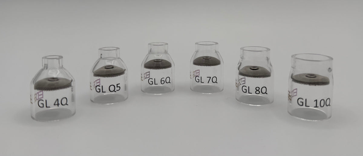 Clear glass welding gas lens cups in various sizes on a white background