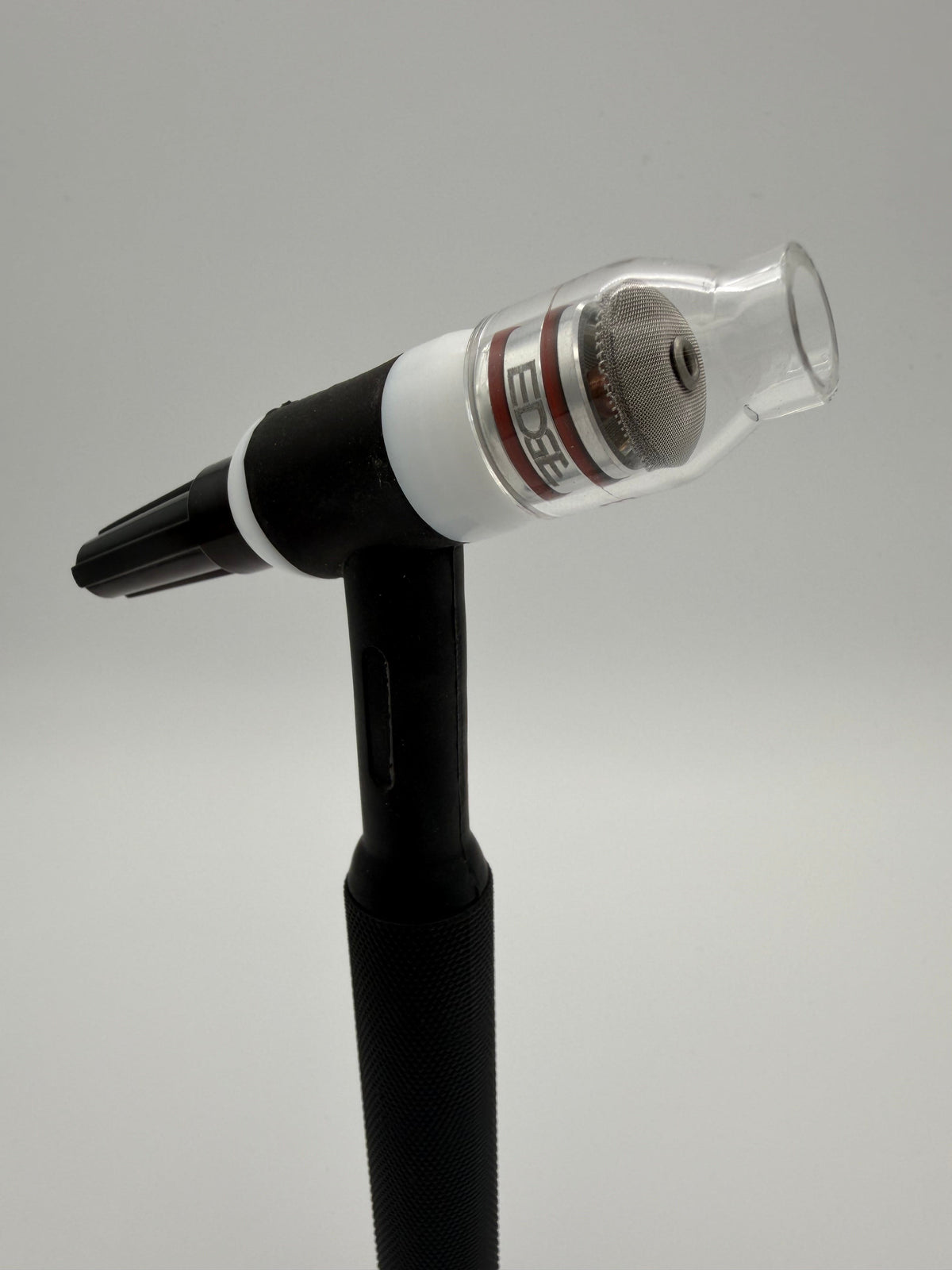TIG welding torch with clear EDGE welding cup and mesh diffuser on white background